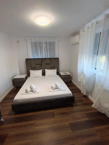 a bedroom with a bed with two pillows on it at Apartamente 9 Teo in Baile Felix