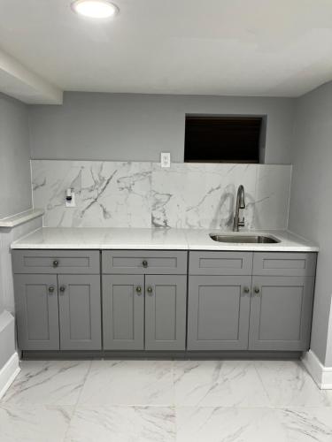a kitchen with a sink and a counter top at Lg2NY in Westerleigh