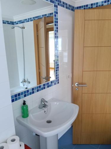 a bathroom with a sink and a mirror at Casa Vistas in Santa Marta de Ortigueira