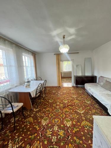 a living room with a table and a couch at Dream house in Türgen