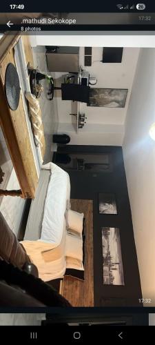 a view of a living room with a couch at Team Sek Guest Studio in Mahikeng