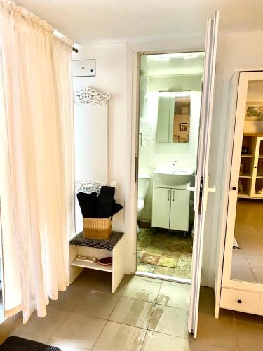 a bathroom with a sink and a mirror at Parasolka in Odesa