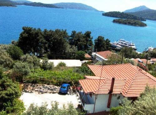 an image of a house with a view of the water at Argyros Studios in Nydri