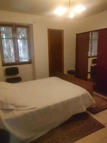a bedroom with a large white bed in a room at Theana in Cazilhac
