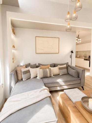 a living room with a couch and a table at NŌSSA Boutique Apartment in Naousa