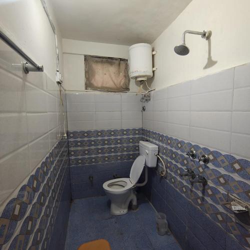 a bathroom with a toilet and a sink at Bunkar house in Tosh