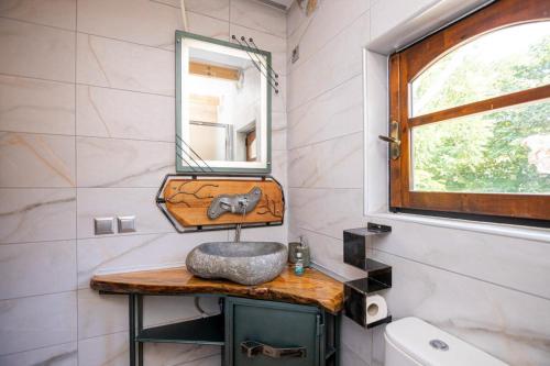 a bathroom with a sink and a mirror at Villa Sofia in Evkarpía
