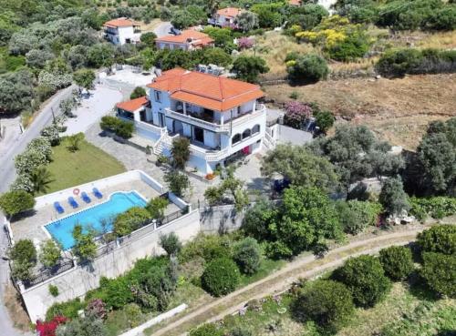 an aerial view of a house with a swimming pool at Villa Karras in Pythagoreio