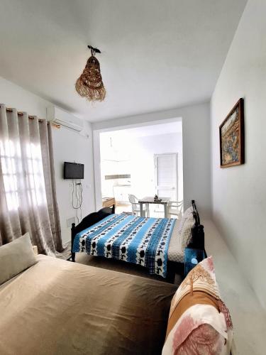 a bedroom with two beds and a window at Dar Nour in Sousse