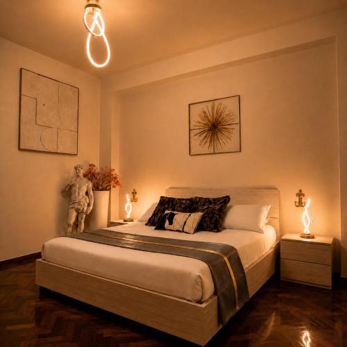 a bedroom with a large bed with two night stands at UTOPIA "The Art of Bed & Breakfast" in Marigliano