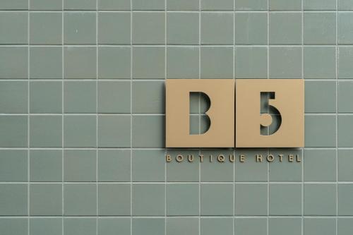 a sign for the building at the headquarters of the hotel at B5 Boutique & Design Hotel - Adults Only in Lugano