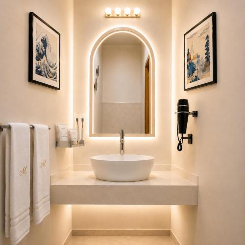 a white bathroom with a sink and a mirror at UTOPIA "The Art of Bed & Breakfast" in Marigliano