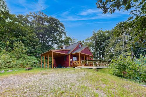 a cabin in the woods with a large yard at Beautiful hilltop home with deck & view of Penobscot Bay - near festivals & more in Rockport