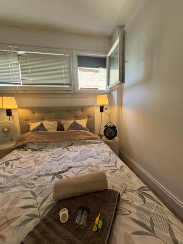 a bedroom with a bed with a tray on it at La nuit calme in Annemasse