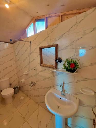 a bathroom with a sink and a toilet at Sina life camp in Nuweiba