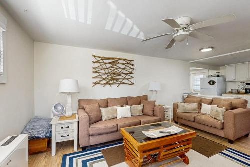 a living room with two couches and a ceiling fan at Well-located, dog-friendly home - walk to footbridge & Barrett Park in Boothbay Harbor