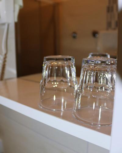 two clear glasses sitting on top of a counter at Penzion Hejtman in Chlum u Třeboně