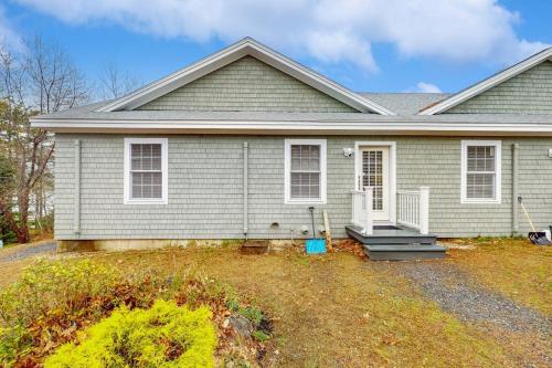 a gray house with a porch and a yard at New Condo w/Water-View Deck in Edgecomb in Edgecomb