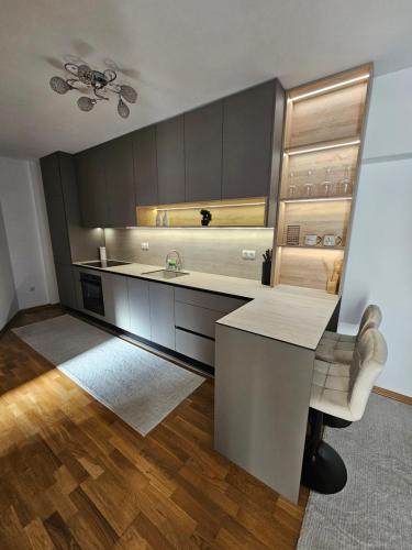 a kitchen with a counter and a table and a chair at La Casa in Livno