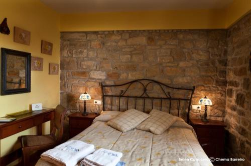 Postel nebo postele na pokoji v ubytování La Casona de Quintes