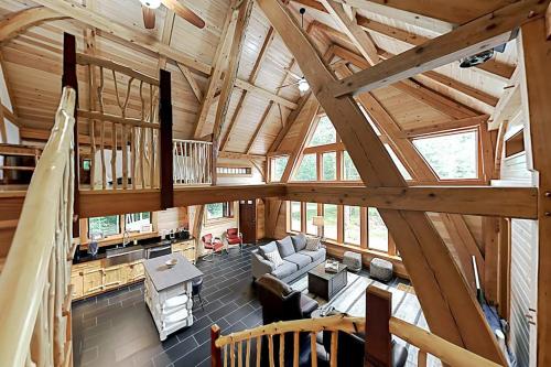 an overhead view of a living room in a log cabin at 2 beautifully designed, off-the-grid homes with amazing lakefront views & access in Franklin
