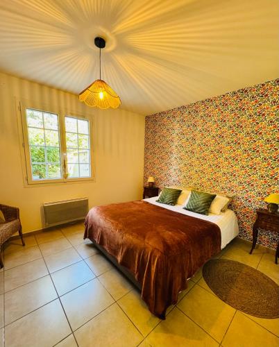 a bedroom with a large bed in a room at Les Terrasses du Vercors in Beauregard-Baret