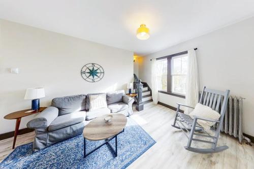 a living room with a couch and a table at Newly Renovated Haven w/ Deck, Walk to Shops, Dining & Marina, Pet friendly in Boothbay Harbor