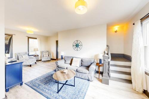 a living room with a couch and a table at Newly Renovated Haven w/ Deck, Walk to Shops, Dining & Marina, Pet friendly in Boothbay Harbor