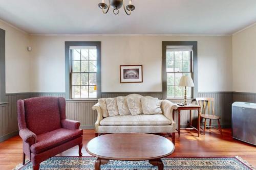 a living room with a couch and a table and chairs at National Historic Landmark Home in Wiscasset Village w/ Complimentary Tour in Wiscasset
