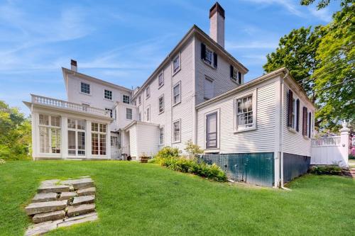 a large white house with a grass yard at National Historic Landmark Home in Wiscasset Village w/ Complimentary Tour in Wiscasset