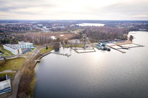 an aerial view of a large lake with a bridge at Nad Zatoką Apartament 340 in Olsztyn