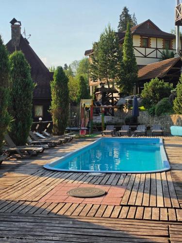 a swimming pool in the middle of a yard at 12 Місяців-Травень in Slavske