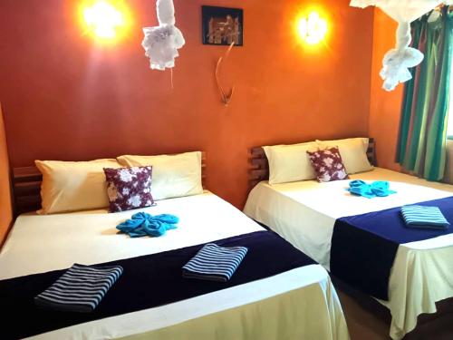 two beds sitting next to each other in a room at කැලෑව Jungle Eco Resort in Anuradhapura