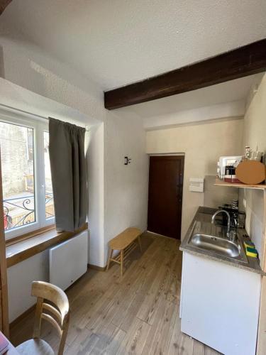 a kitchen with a sink and a counter top at Gallice Bey in Briançon