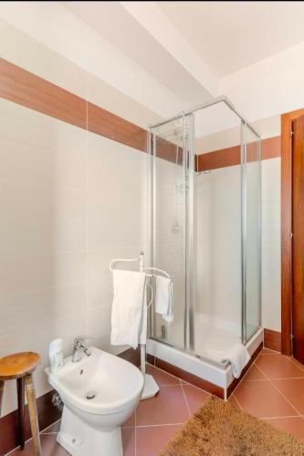 a bathroom with a shower and a toilet and a sink at Raggio Di Sole in Cosenza