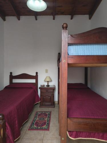 a bedroom with two bunk beds and a table at Duplex EyC in Colón