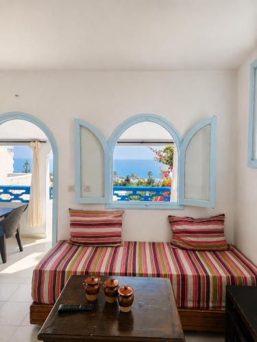 Giường trong phòng chung tại La Planque - Appart Hôtel - Vue sur mer
