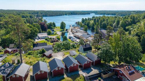 an aerial view of a small town next to a river at Visitor Stugby in Håverud