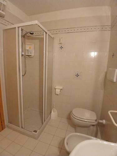 a bathroom with a shower and a toilet and a sink at Casa Campani in Monclassico