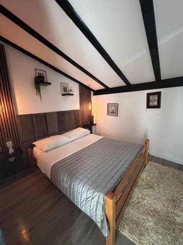 a bedroom with a large bed in a room at Casa del Mare in Vodice