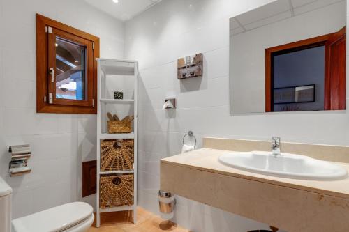 a bathroom with a sink and a toilet at Ca'n Cristofal in Felanitx