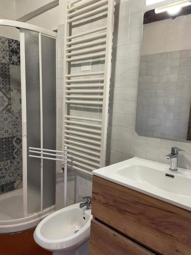 a bathroom with a sink and a toilet and a shower at Casa con Piscina Climatizzata - Vecchia Stalla in Casa Montacuto