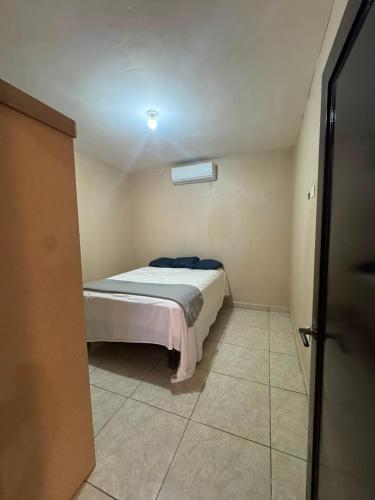 a small bedroom with a bed in a room at Departamento #1 in San Carlos