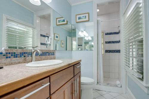 a bathroom with a sink and a toilet and a shower at Turtle Nest Condo - Pool - 2nd Floor in Key West