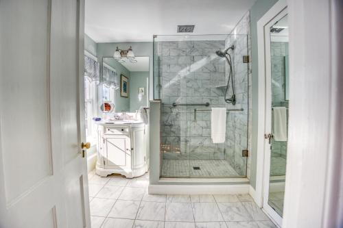 a bathroom with a walk in shower and a sink at The Inn at Stockbridge in Stockbridge
