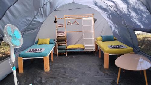 two chairs and a table in a tent at Summer IGLOO by the sea in COCOland in Pálioura