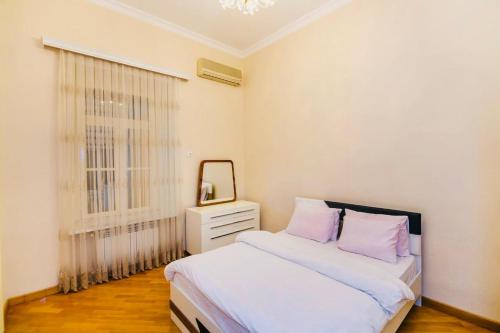 a bedroom with two beds and a mirror in it at 3 Bedrooms Apartment ın Center in Baku