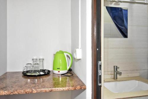 a kitchen counter with a green appliance on it at Zvartnots in Zvartnots International Airport