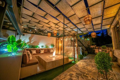 a living room with a couch and a table at Louis Cappadocia in Uçhisar