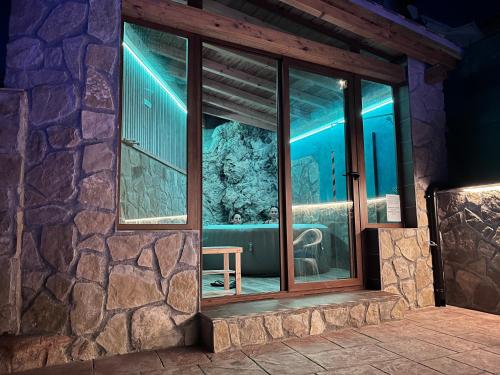a room with a window with a view of an aquarium at Casa Angel in Cazorla